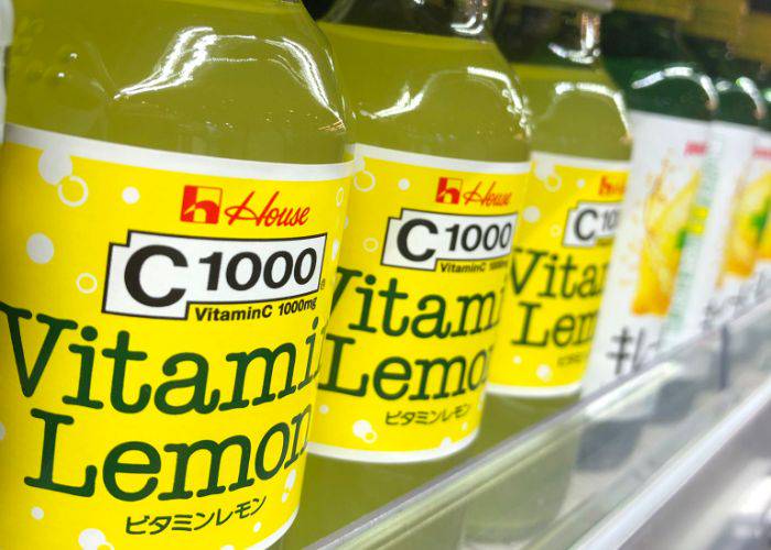 A close-up of the vitamin drink range at a supermarket, with the C1000 Vitamin Lemon drink closest to the camera.